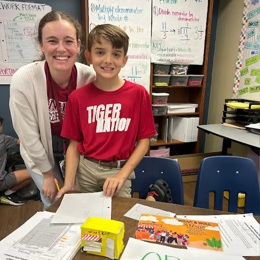 Middle school student and middle school teacher with project.