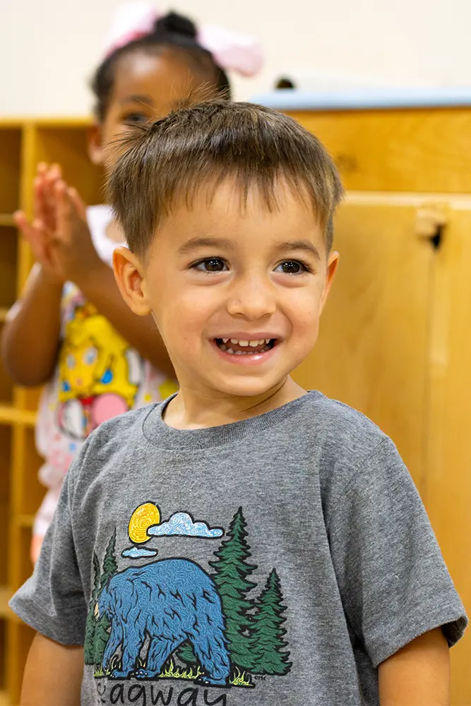 Early childhood student learning in classroom.