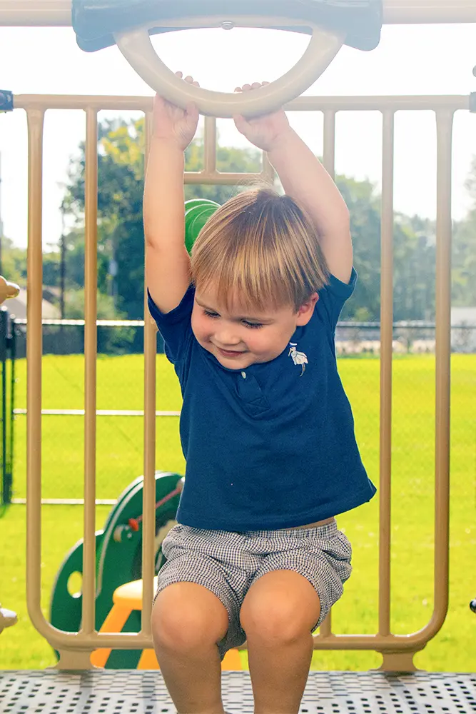 Early childhood student playing on playground
