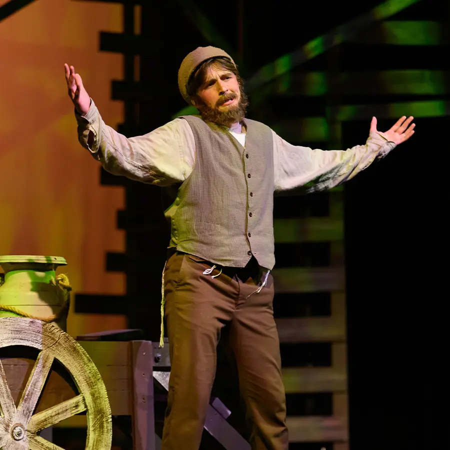 Male upper school actor performing on stage
