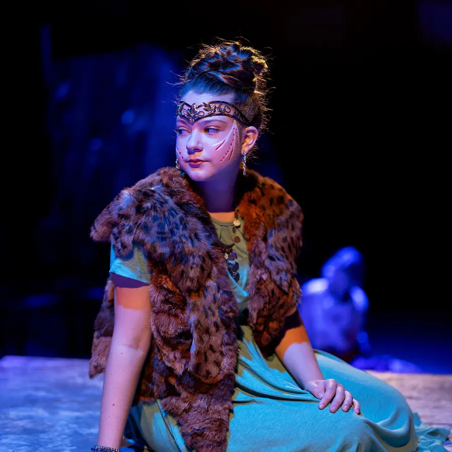 Middle school actress performing on stage