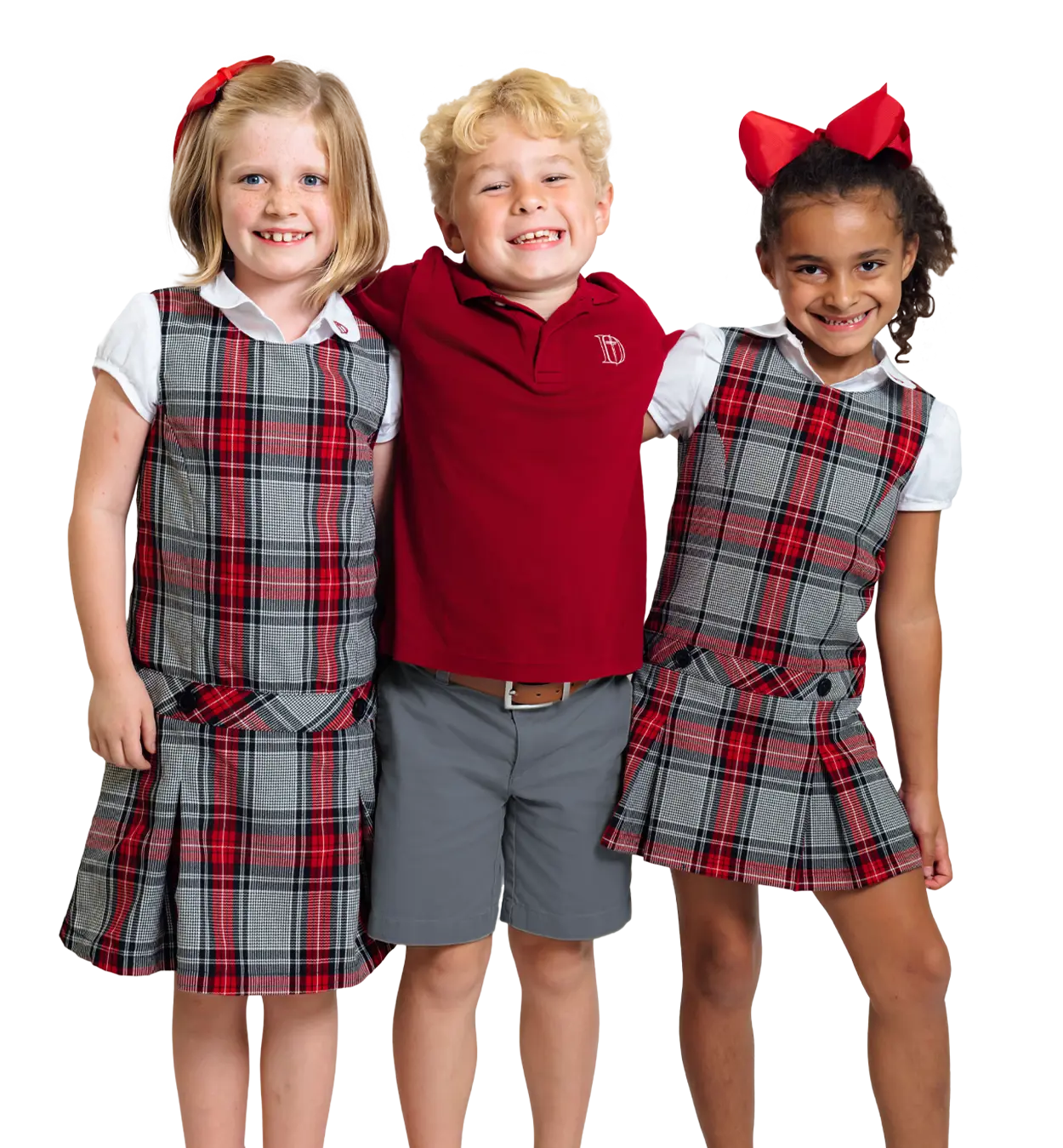 Three lower school students smiling