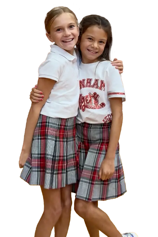 Two middle school students smiling