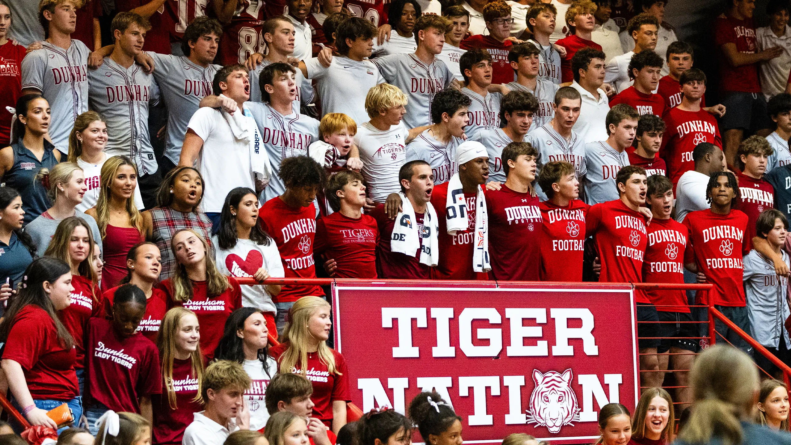 Dunham high school students cheering at an athletic event.